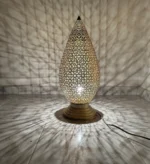 Moroccan brass table lamps Handcrafted brass lamps Moroccan table lighting Brass desk lamps Moroccan-style lamps Bohemian brass lamps Antique Moroccan lamps Decorative brass table lamps Artisan brass lamps Vintage Moroccan lighting Moroccan bedside lamps Intricate brass lamps Moroccan accent lighting Brass lantern table lamps Traditional Moroccan lamps