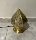 Moroccan brass table lamps Handcrafted brass lamps Moroccan table lighting Brass desk lamps Moroccan-style lamps Bohemian brass lamps Antique Moroccan lamps Decorative brass table lamps Artisan brass lamps Vintage Moroccan lighting Moroccan bedside lamps Intricate brass lamps Moroccan accent lighting Brass lantern table lamps Traditional Moroccan lamps