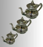 Moroccan silver teapot Traditional tea set Moroccan tea culture Silver teapot design Handcrafted silverware Moroccan decor Artisan teapots Vintage silver teapot Decorative tea accessories Moroccan tea ceremony
