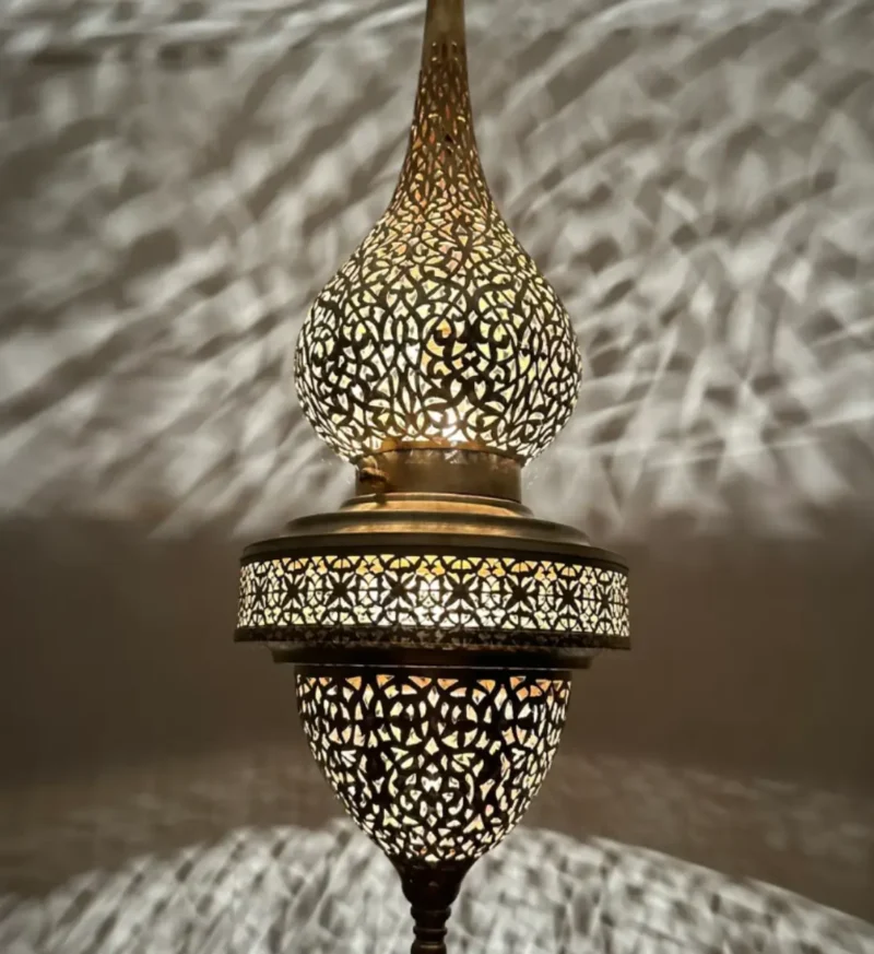 Modern brass outdoor wall light with a minimalist design, ideal for patios and entryways.