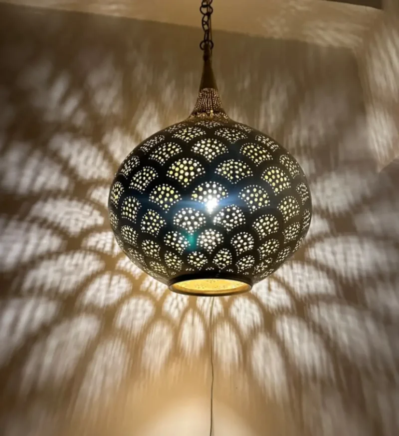Modern black and brass chandeliers featuring a sleek and stylish finish.