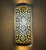 Vintage brass wall sconce with intricate detailing adding elegance to a classic interior