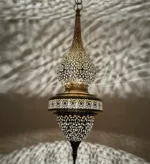 Brass outdoor wall light with a modern design, perfect for exterior lighting.