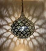 Elegant black and brass chandelier hanging in a modern interior