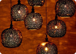 HOME Beautiful handcrafted Moroccan style lamp with intricate patterns, casting a soft and warm glow.